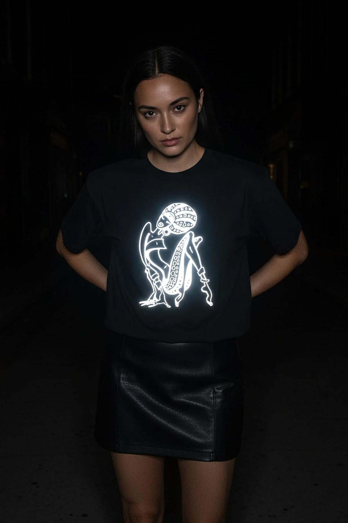 Reflective heat transfer print detail on black t-shirt light reaction effect
