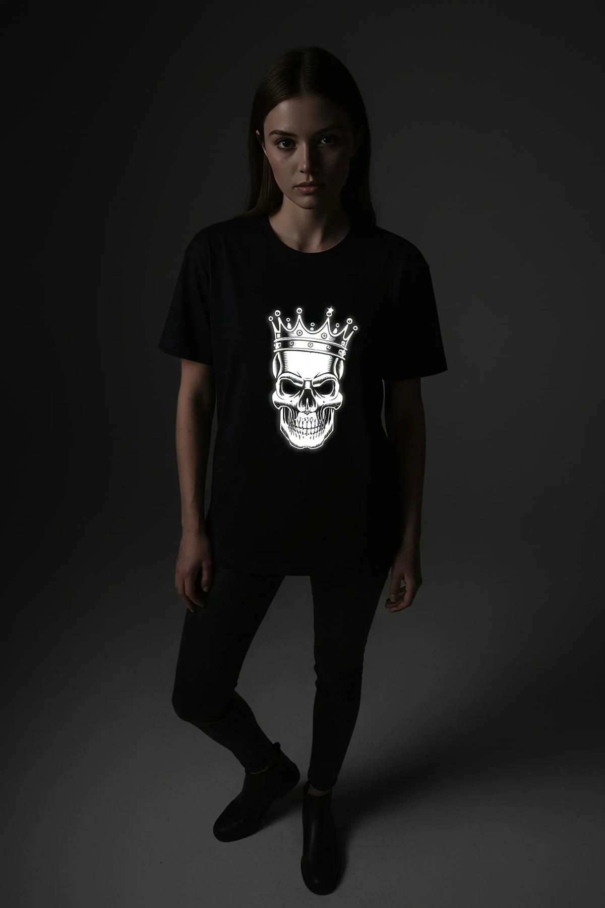 black oversize t-shirt with reflective crowned skull front print glowing white in low light
