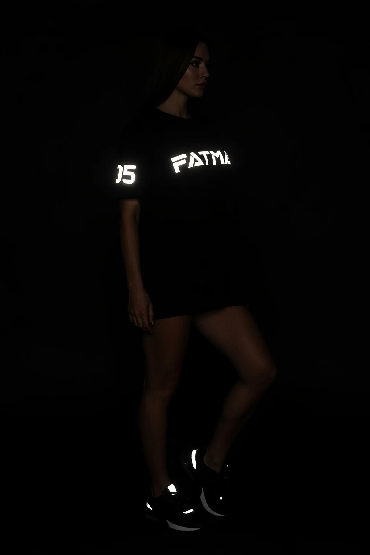 Oversize black t-shirt with reflective FATMA 05 graphic, dropped shoulder silhouette on female model