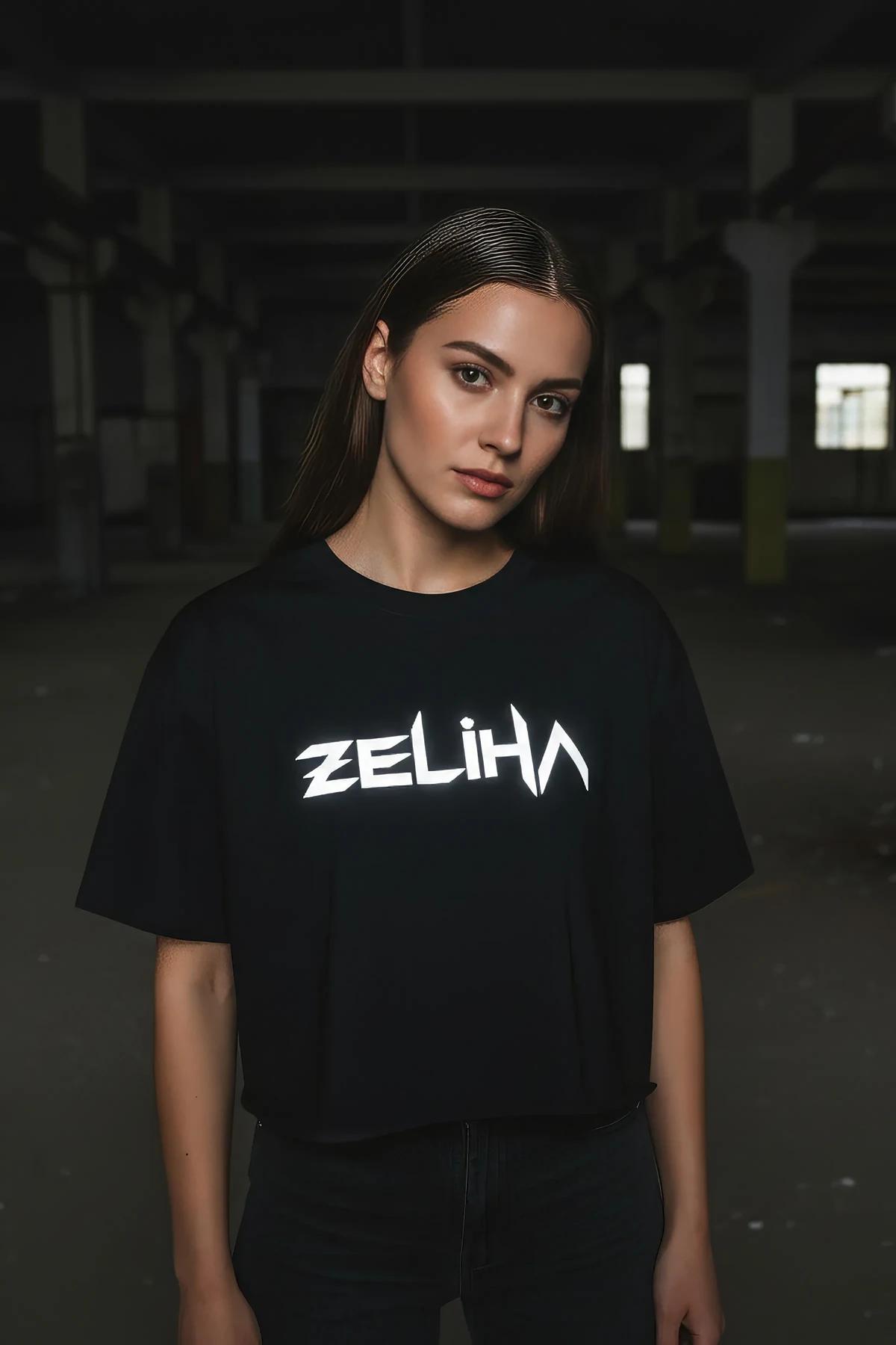 Front view black cotton t-shirt with retroreflective ZELIHA geometric typeface print center chest