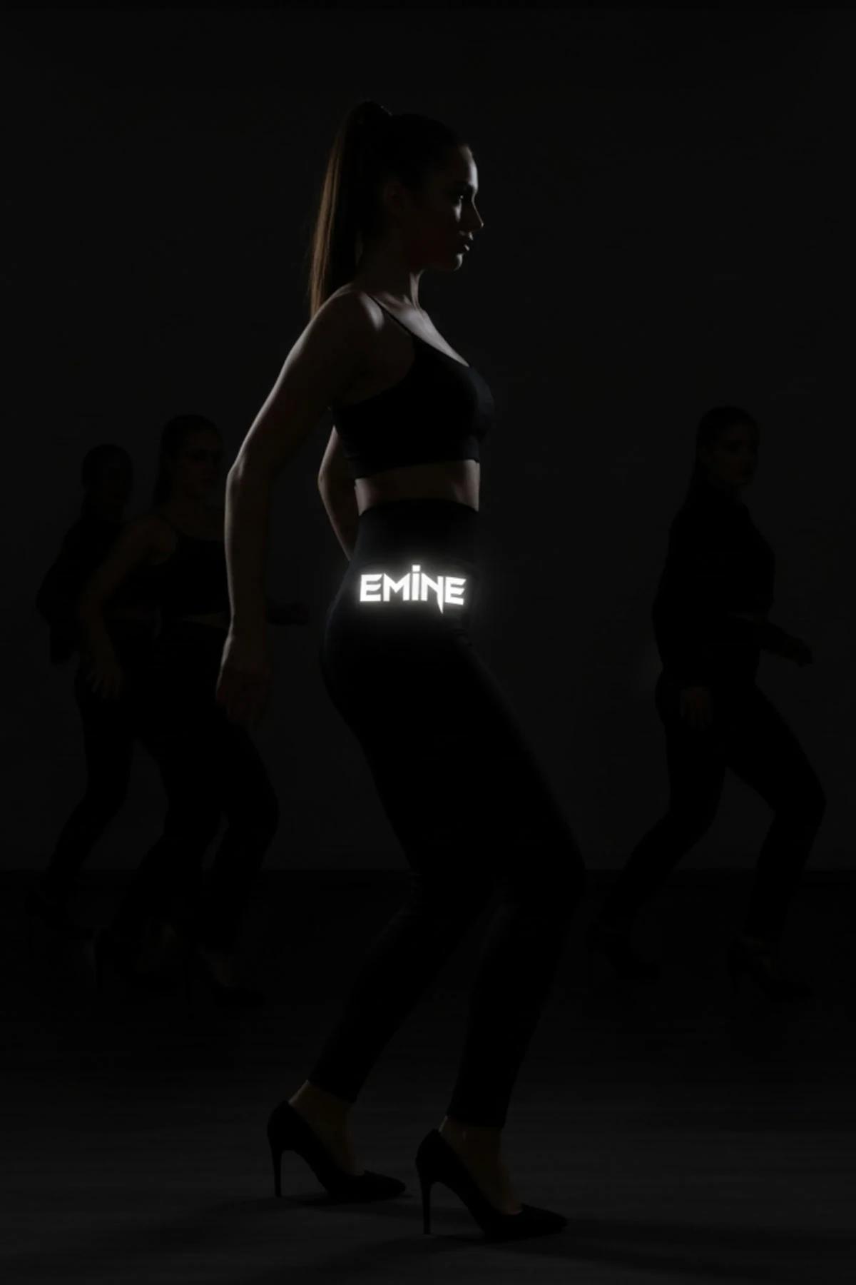 black high-waist reflective name print leggings glowing EMİNE text on waistband dark studio