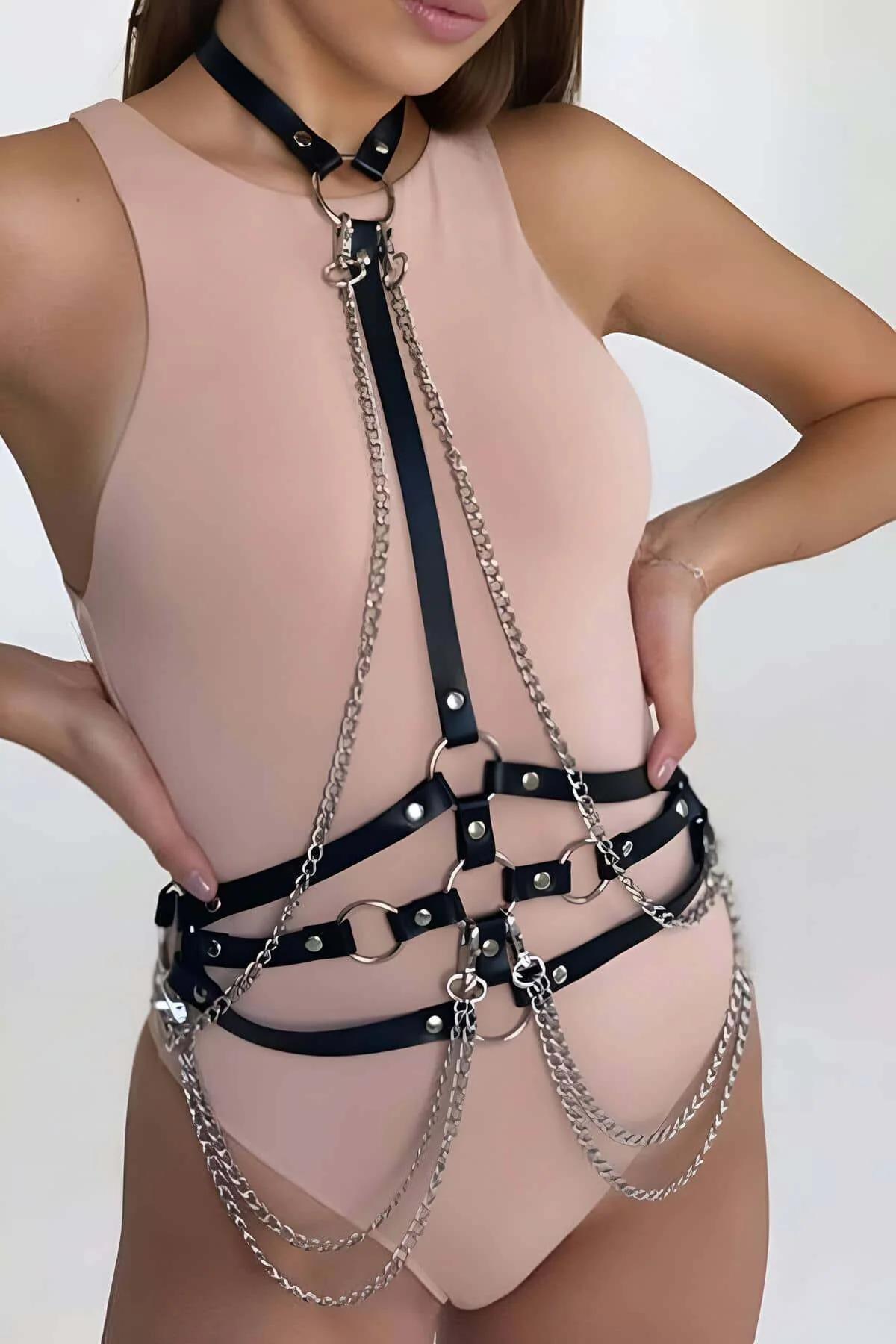 Black PU leather chest harness showing horizontal strap bands and four silver O-rings with rivet detail