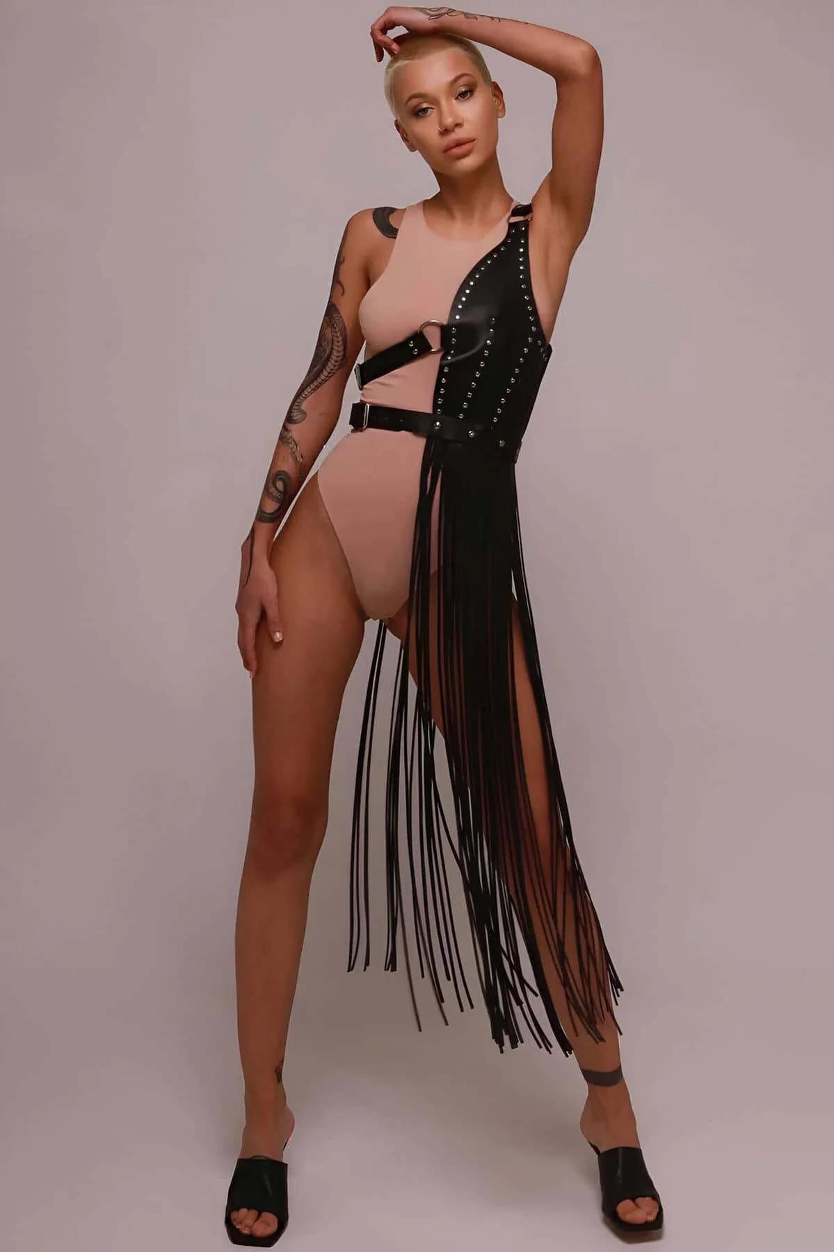 Adjustable D-ring side buckle detail on black faux leather harness skirt