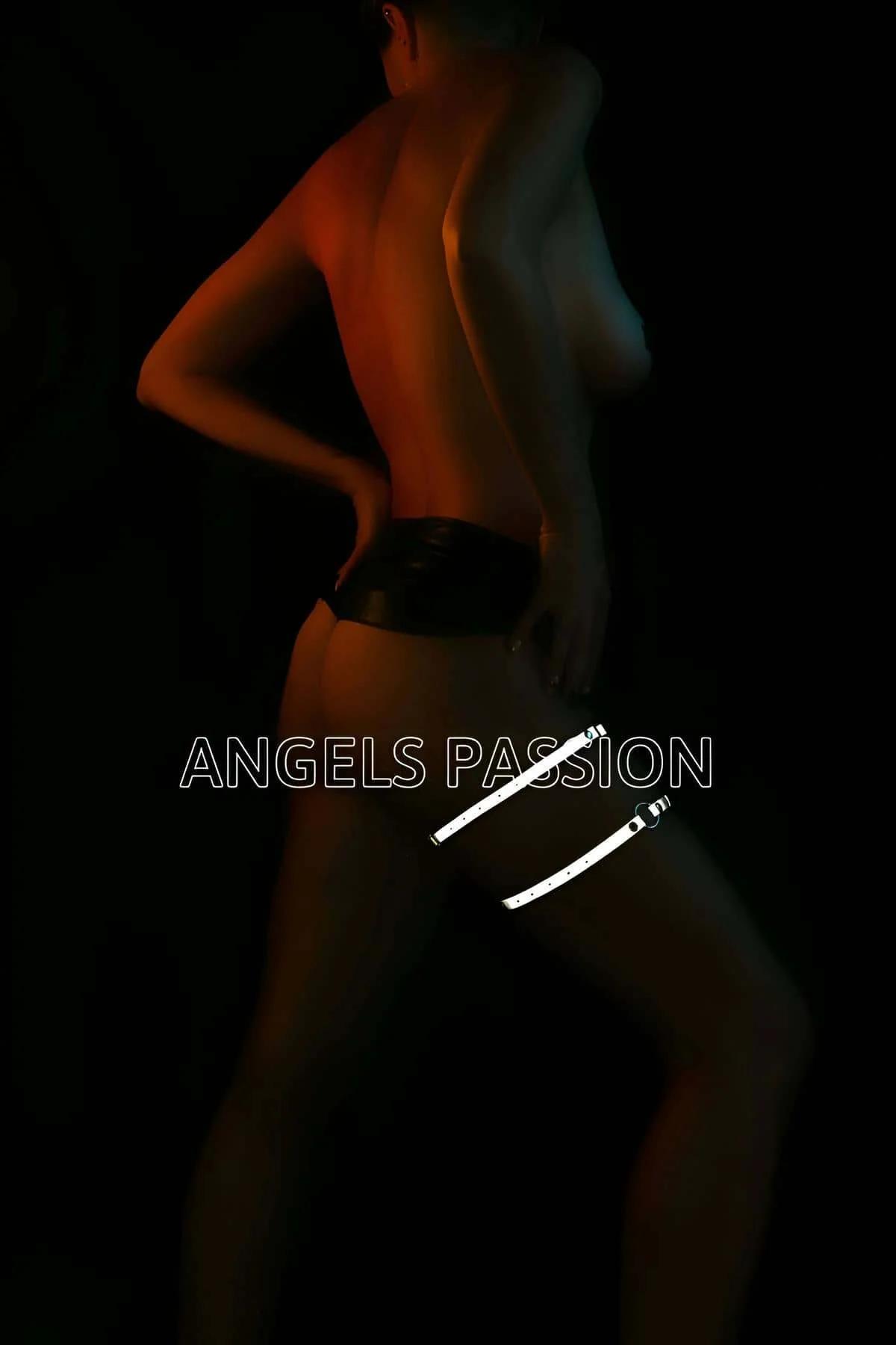 Black O-ring body harness glowing bright white-silver under direct flash photography
