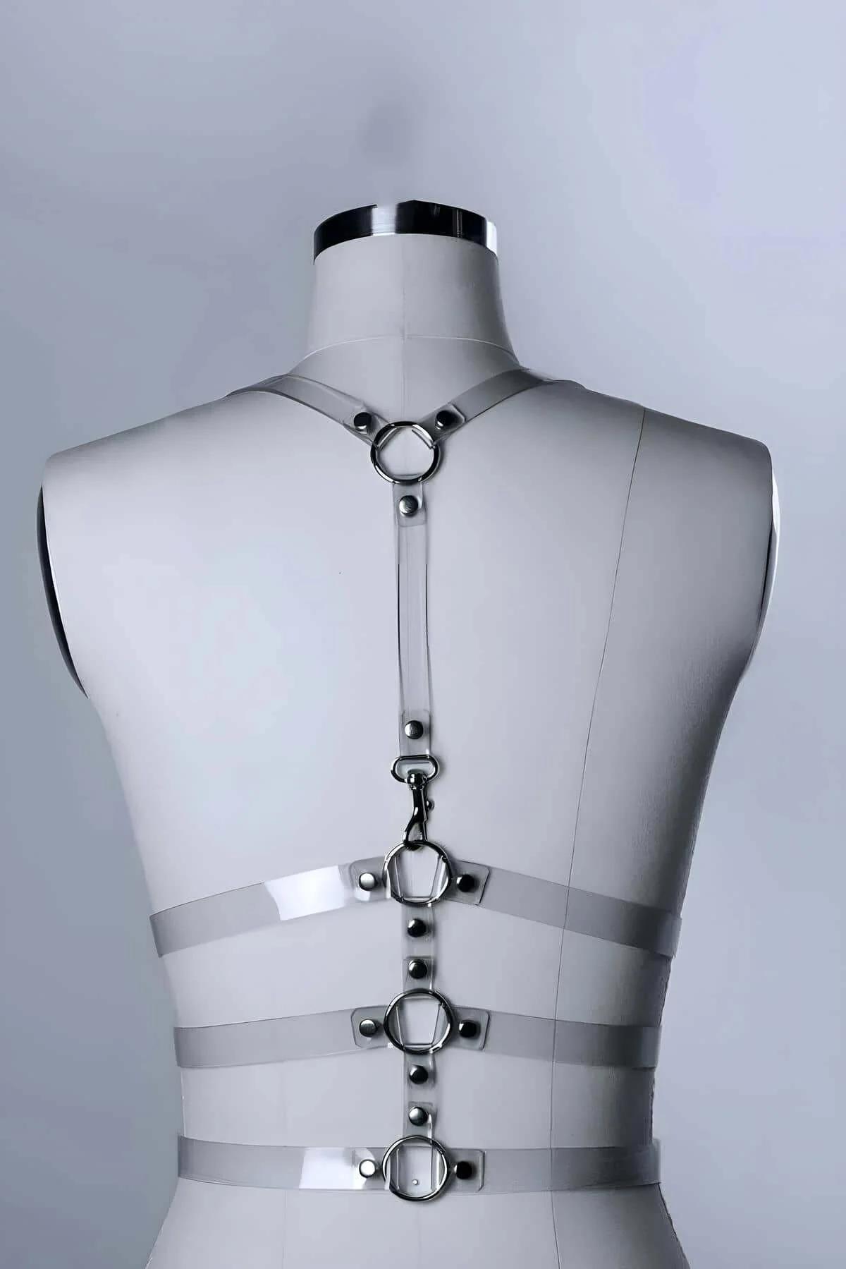 transparent chest harness thin shoulder straps with slide buckle adjustment detail