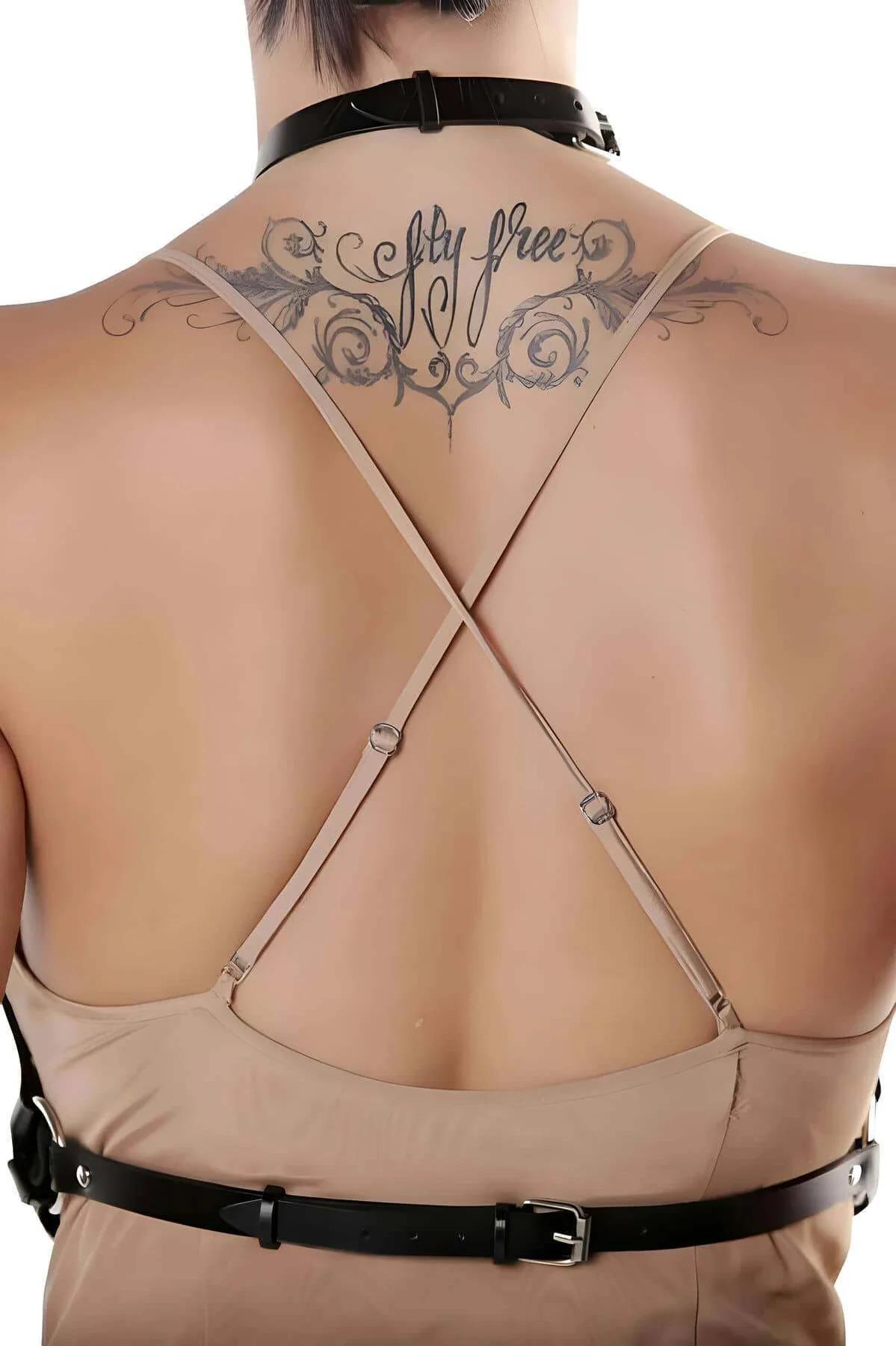 Back view of black faux leather harness showing halter neck strap and adjustable buckle configuration
