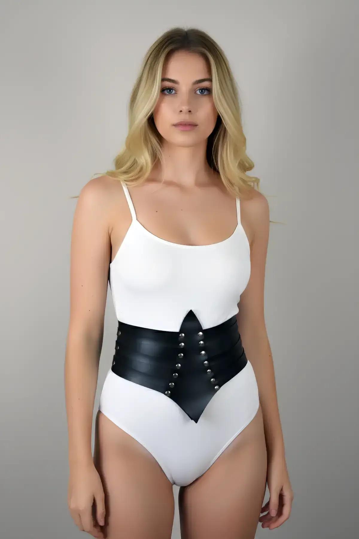 Black studded waist cincher belt showing pointed center front detail and side eyelet closure