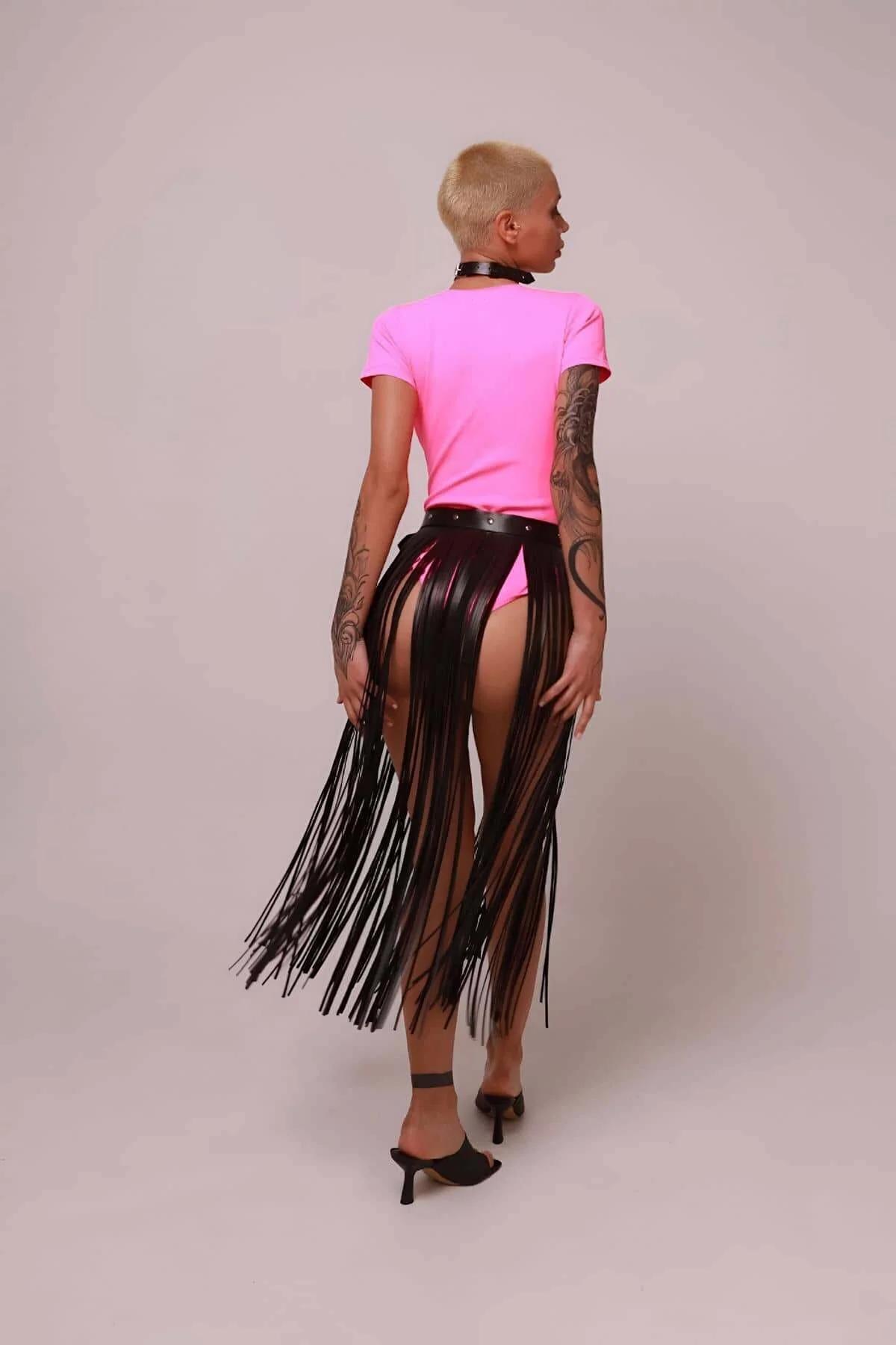 black fringe skirt overlay layered over shorts showing knee-length fringe fall