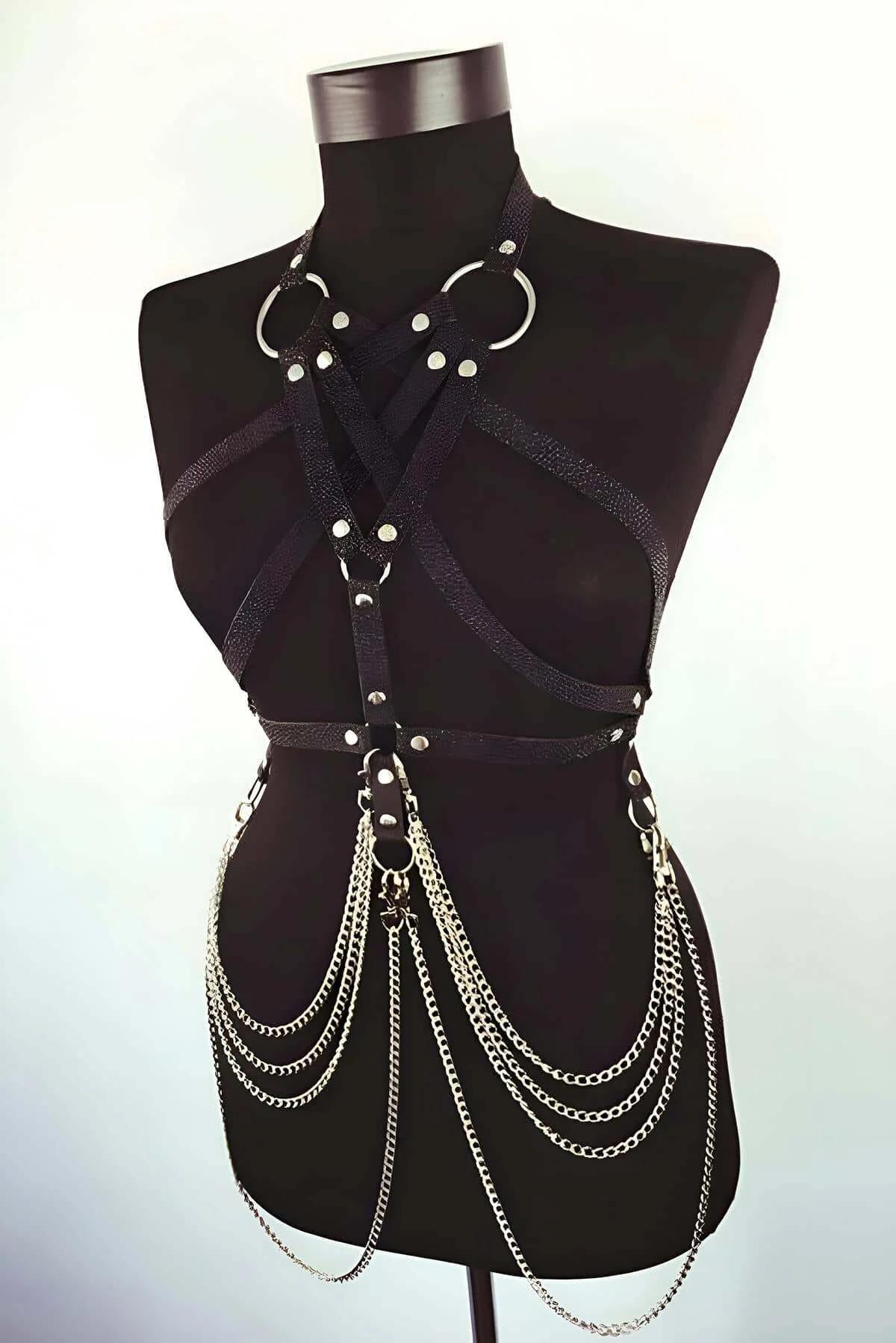 silver cascading chain skirt section of black faux leather body harness waist band detail