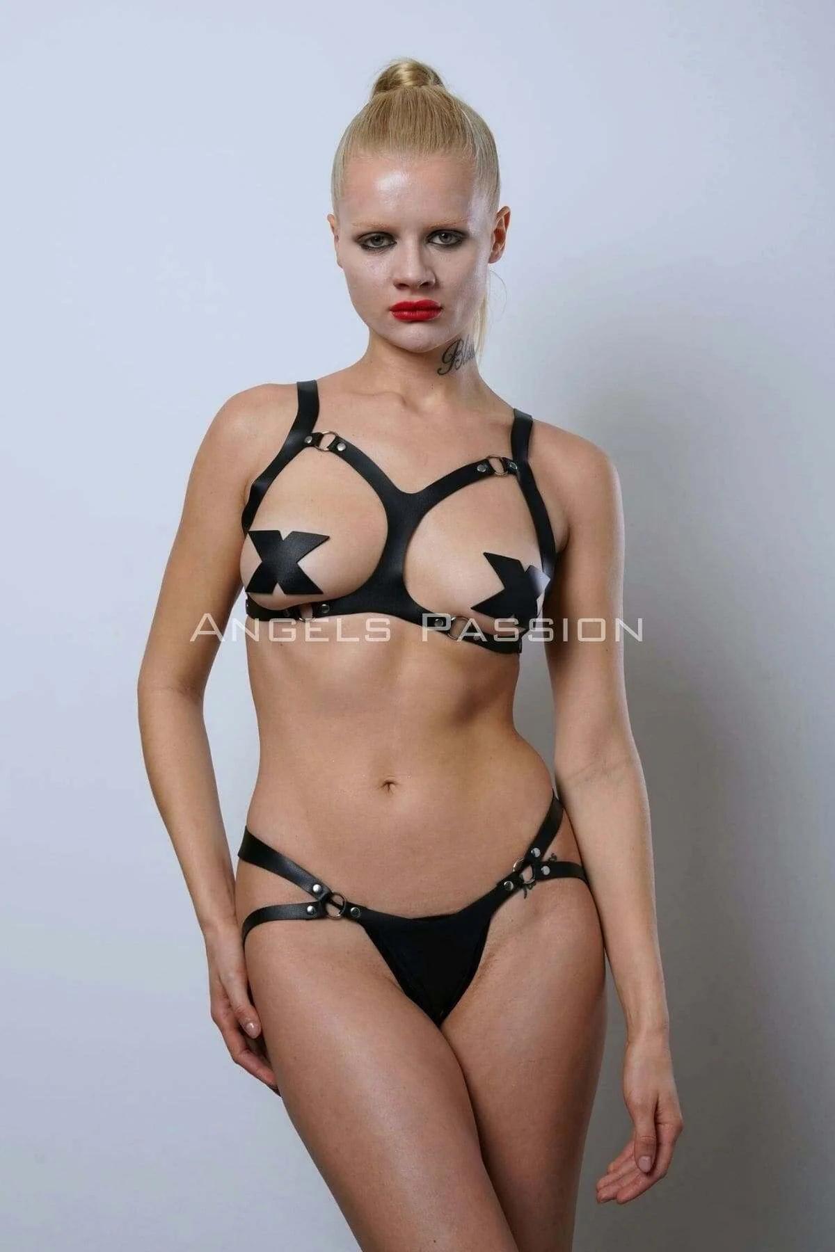 black strappy thong with hip strap detail and gold-tone O-ring hardware close-up