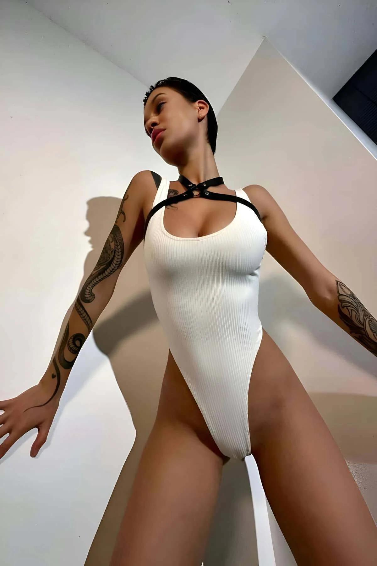 front view of black chest harness halterneck tie and dual strap configuration against neutral background