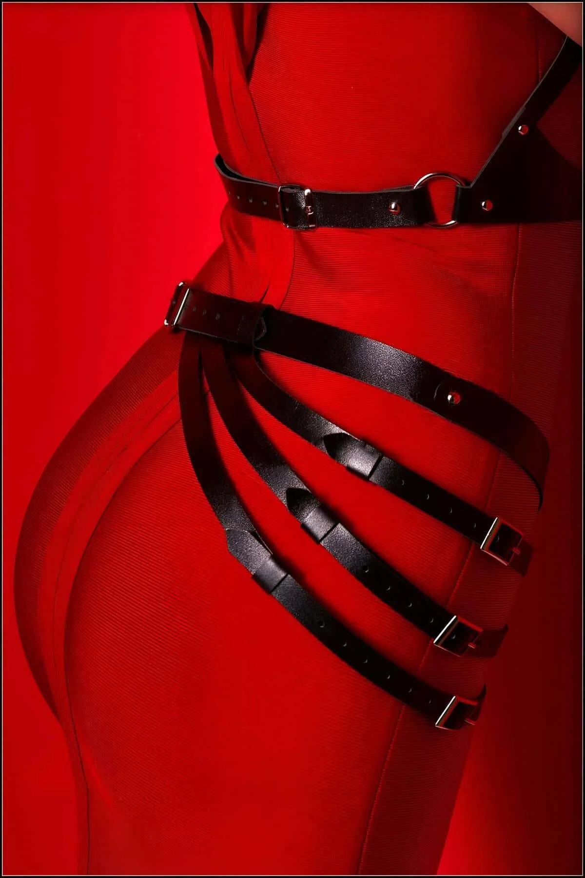 Black PU harness upper section showing triangular chest panel and adjustable silver-buckle shoulder straps