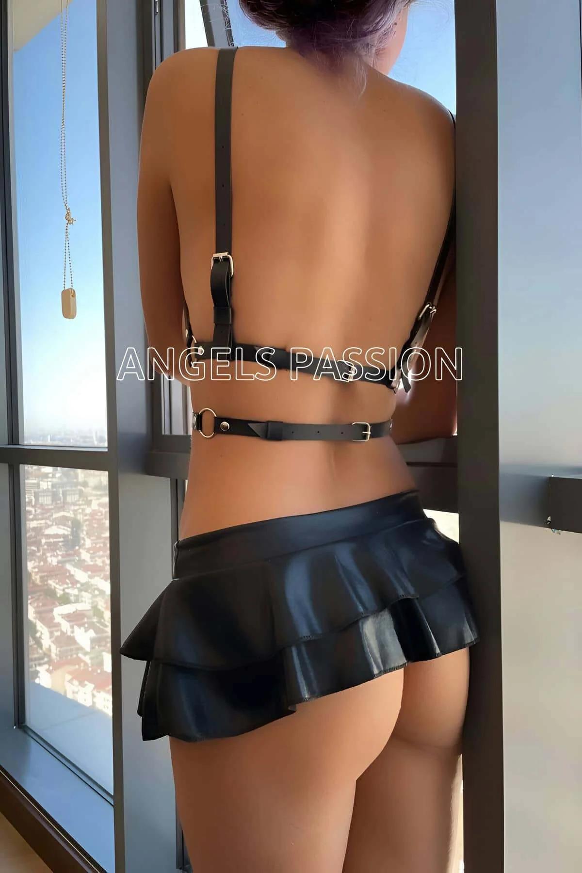 Close-up of silver dome stud choker neckband on black PU faux leather harness