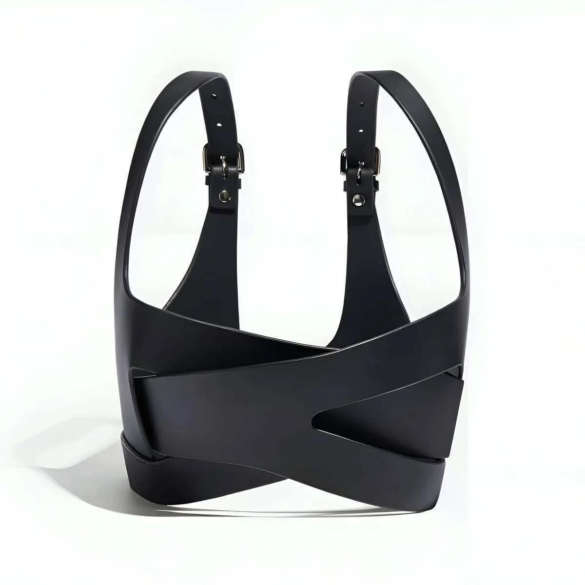 front view of black faux leather harness top showing criss-cross strap overlap at center chest