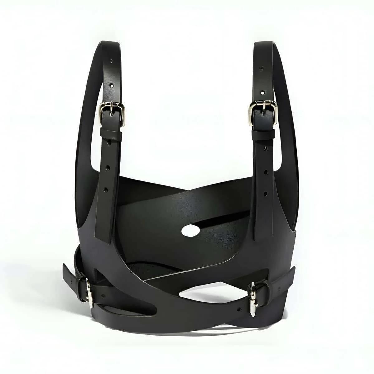 close-up of matte PU leather surface and diagonal strap construction on black chest harness top