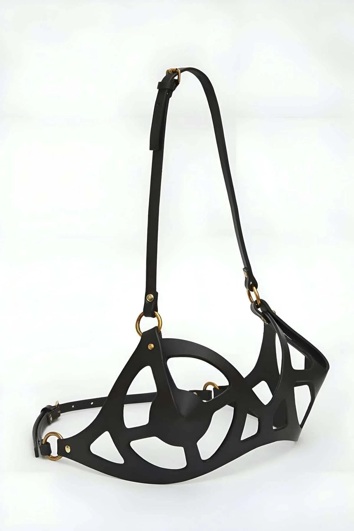 Close-up of black faux leather cut-out cup structure showing oval window openings and 1.5 cm bands