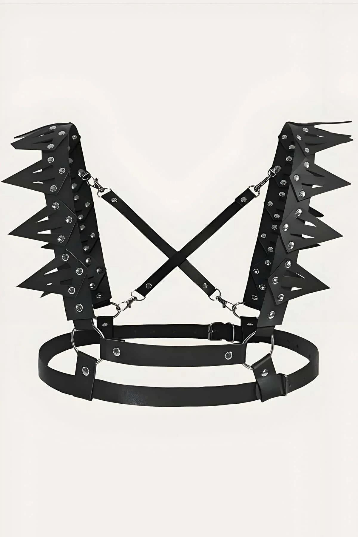 Spiked black faux leather chest harness layered over red lace bralette showing full strap configuration
