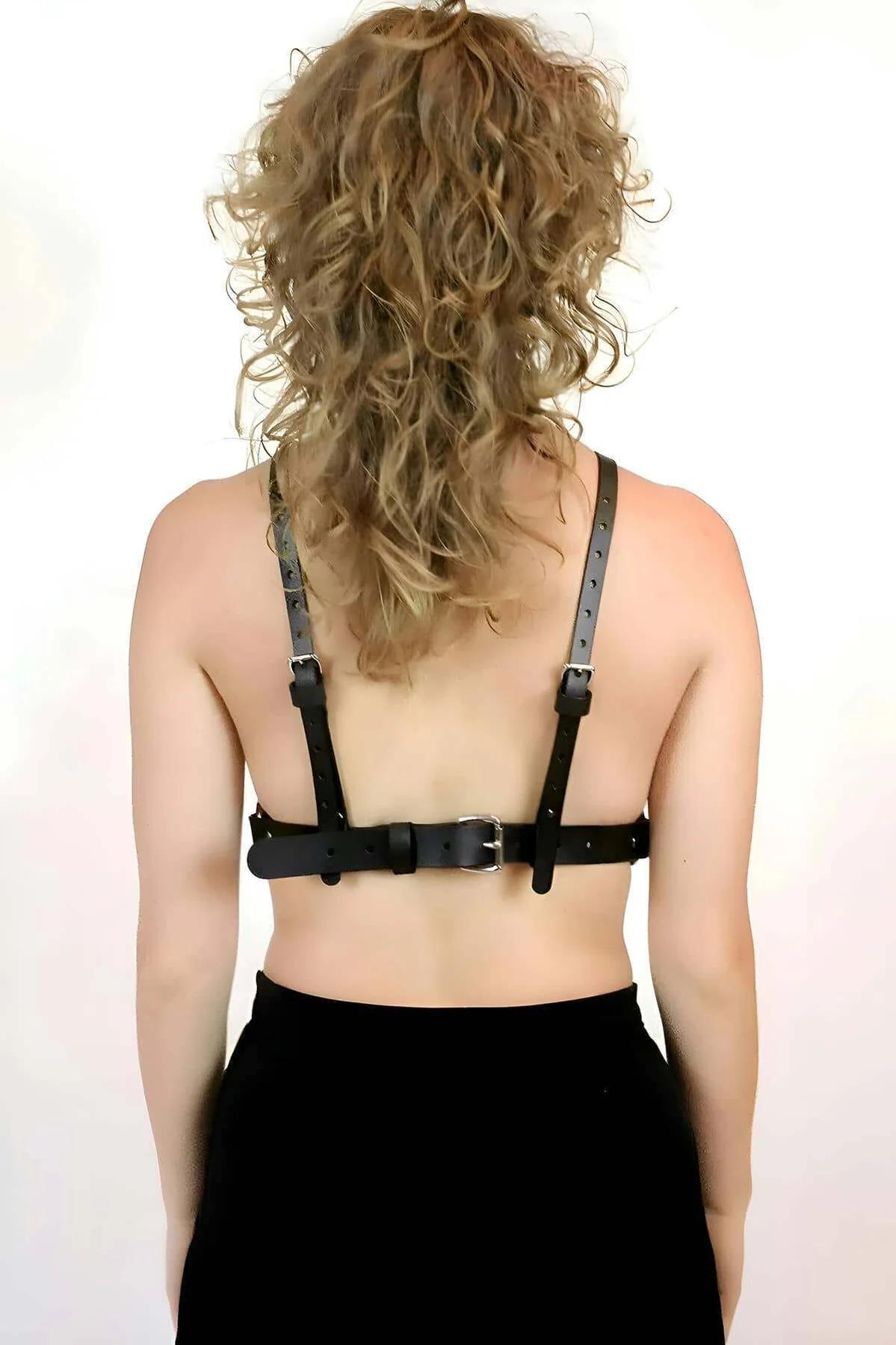 Black faux leather chest harness adjustable back strap with silver buckle detail
