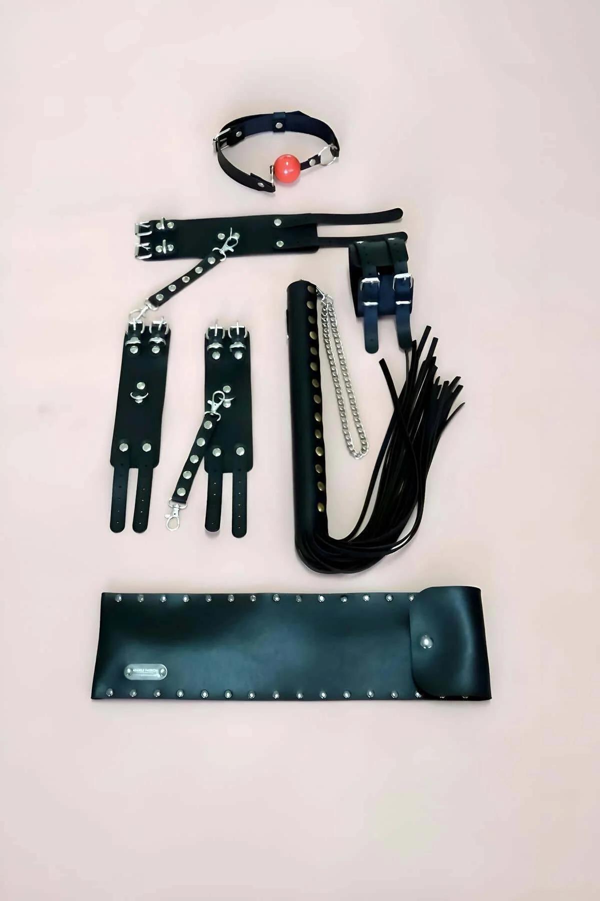 black faux leather studded wrist cuffs with lobster clasp connector and double press-stud closure detail