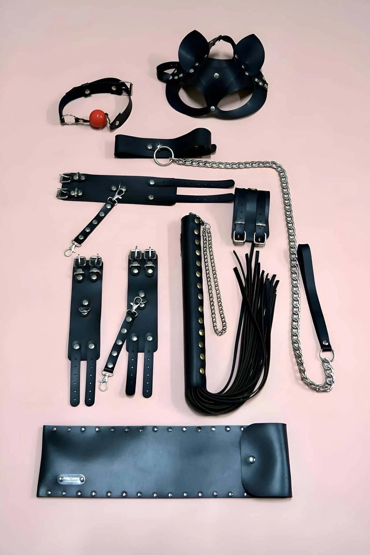 matte black vegan leather cat-ear mask with silver dome studs and elasticated band