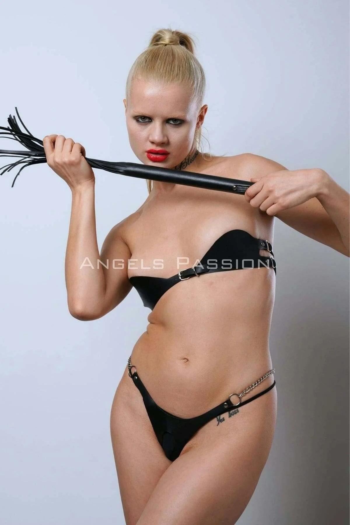 Black faux leather thong with adjustable side closures and gold chain accent, side angle