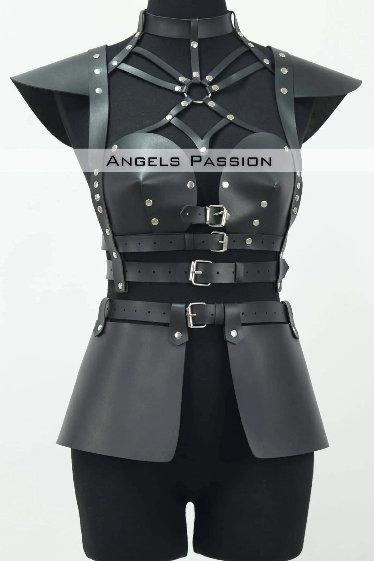 Sculpted black faux leather skirt panels front view hanging from waist belt with silver buckles