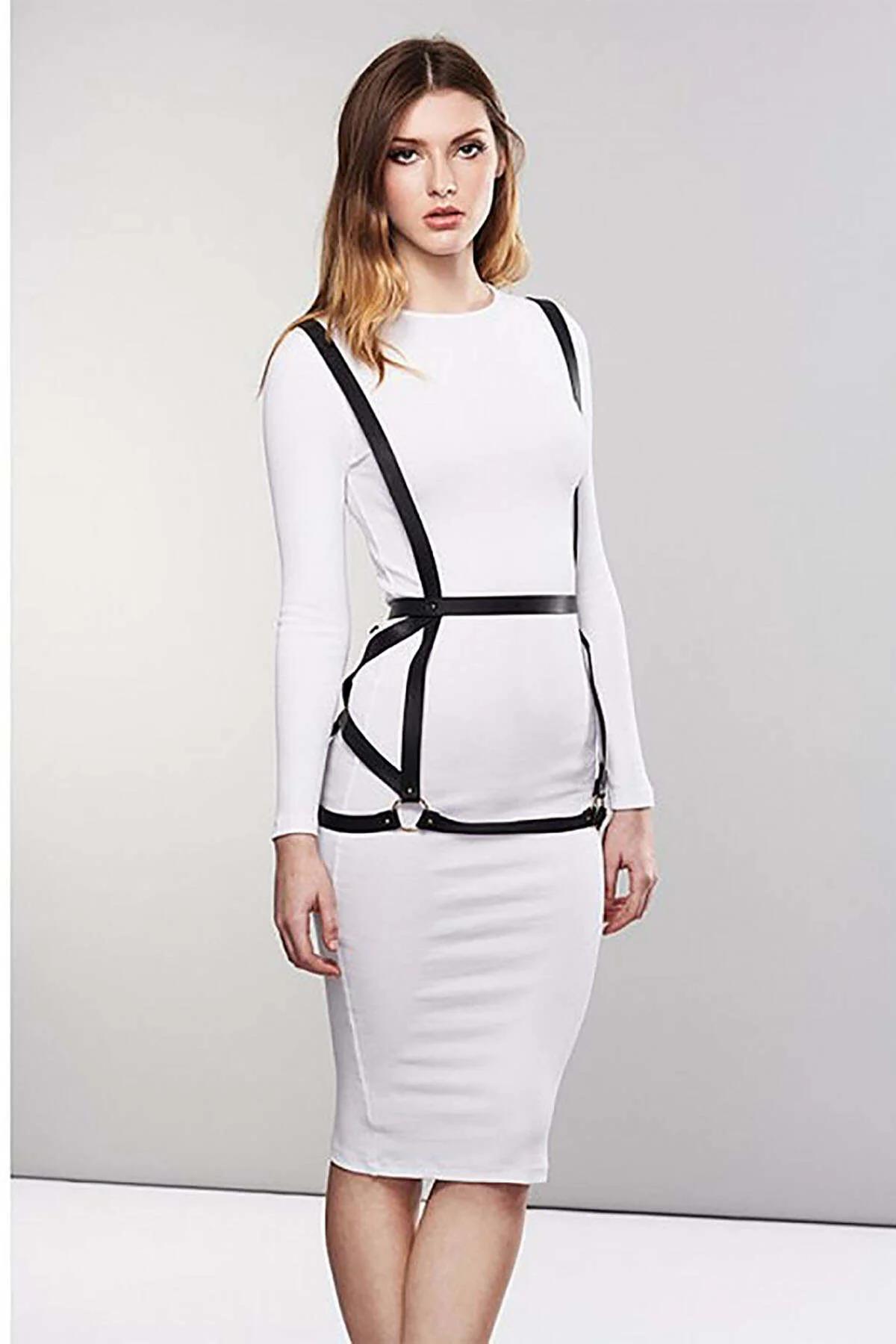 back view of black adjustable body harness showing buckle closure at waist