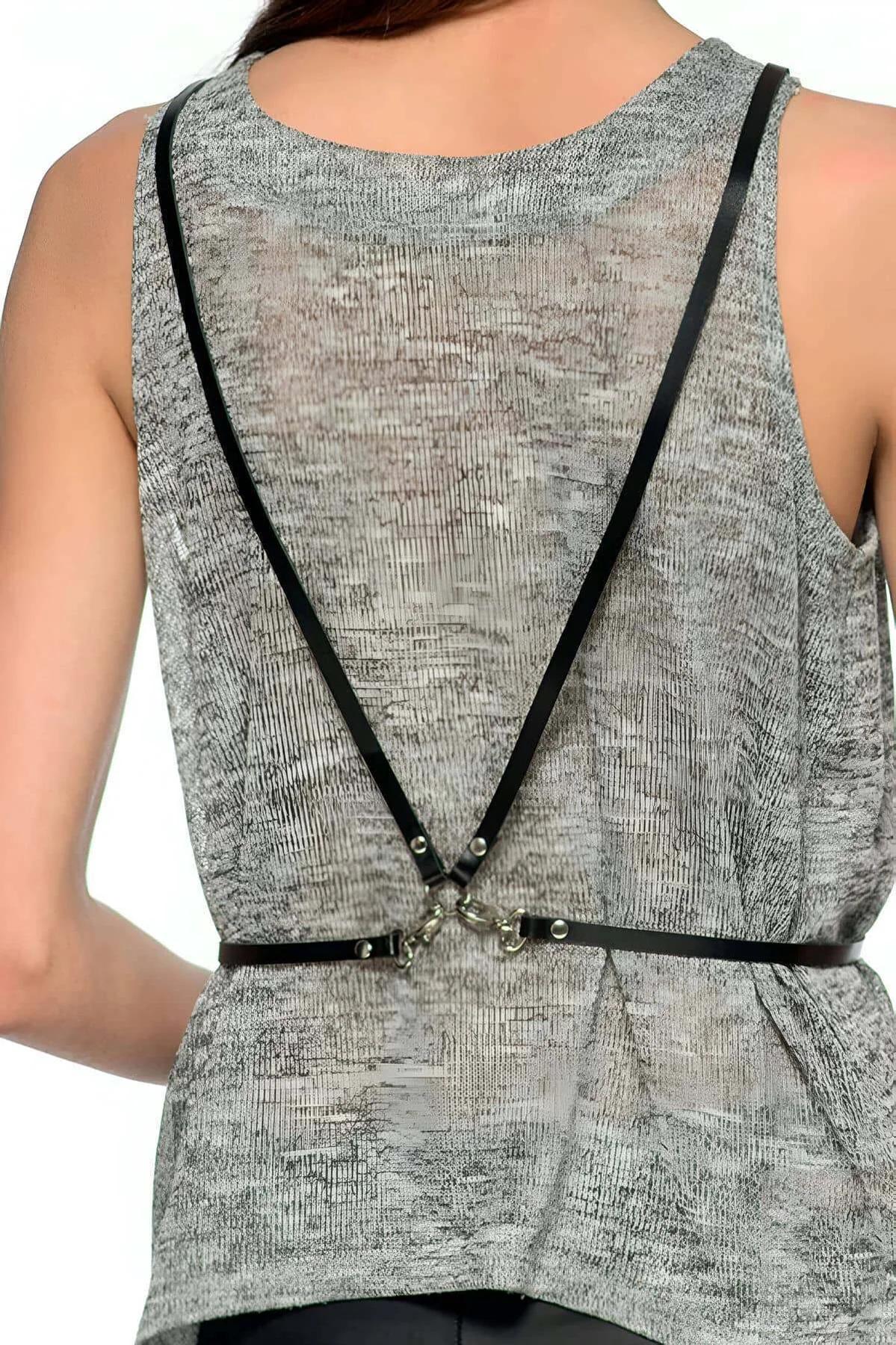black PU leather chest harness angular strap pattern with multiple silver O-ring connectors front view