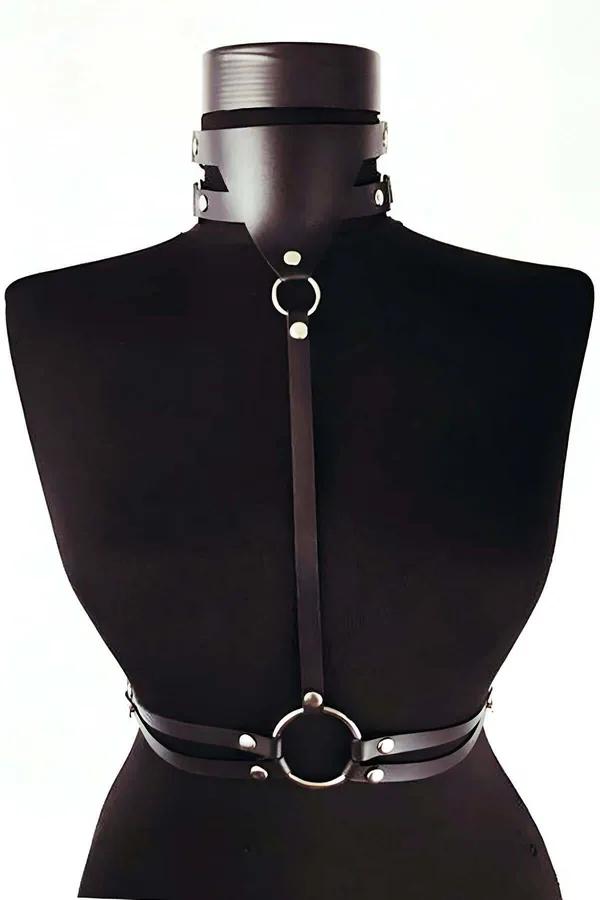 Black faux leather collared full body harness with silver O-ring at waist and sternum, front view on mannequin