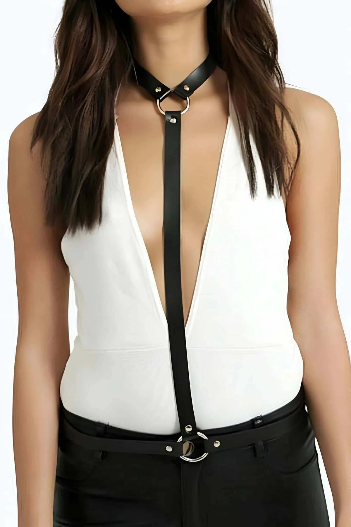 Close-up of silver O-ring and rivet hardware on black faux leather choker strap