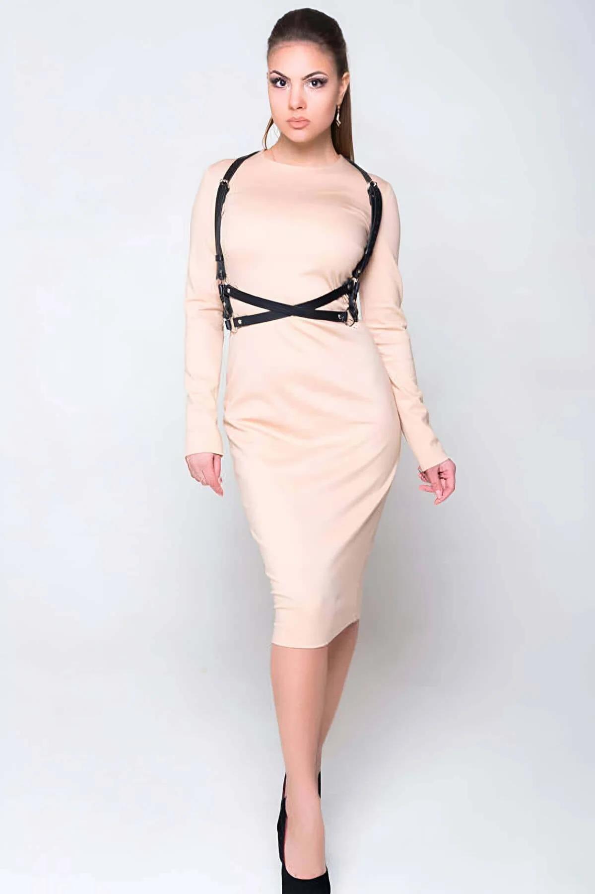 Black strappy chest harness gold pin buckles shoulder adjustment detail