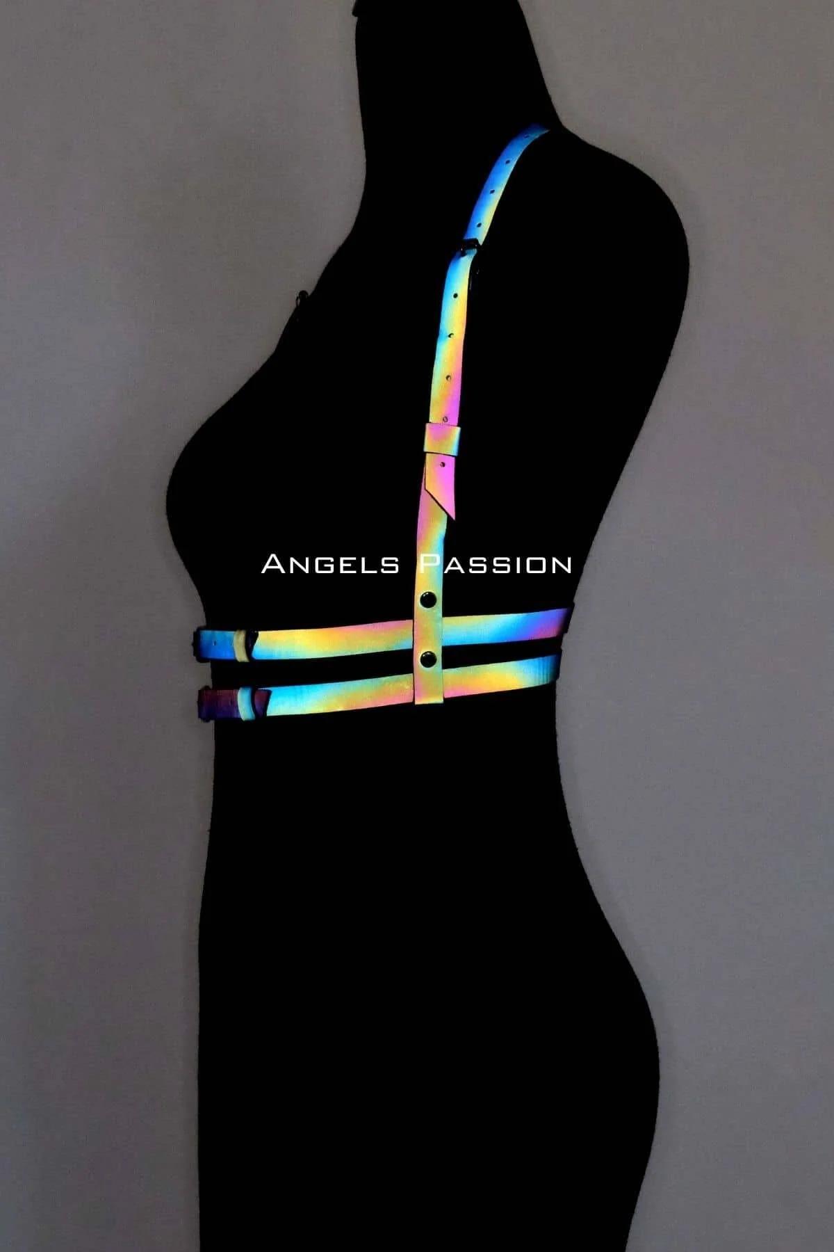 Rainbow reflective harness front view showing two waist bands and diagonal shoulder straps in full color spectrum