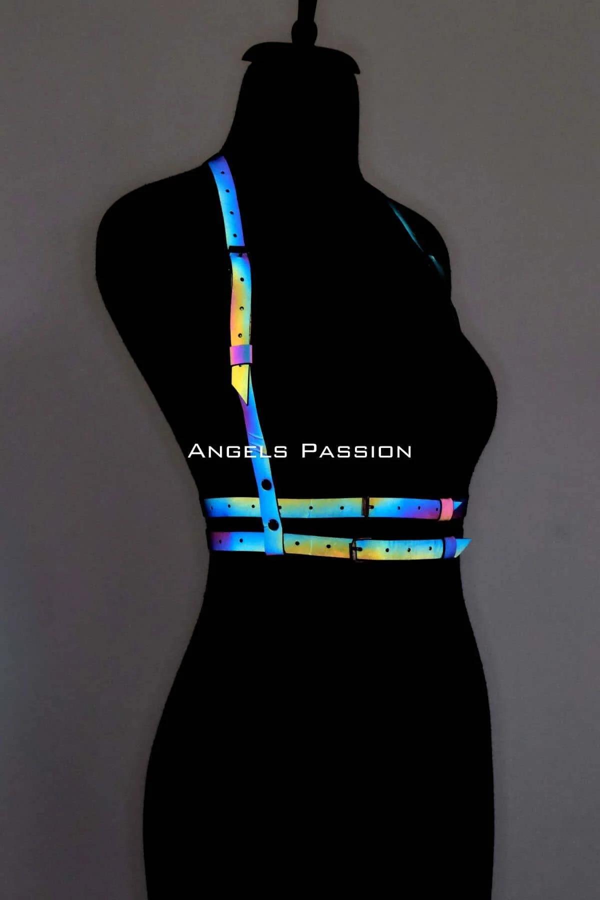 Rainbow festival body harness worn on dark mannequin showing holographic strap configuration