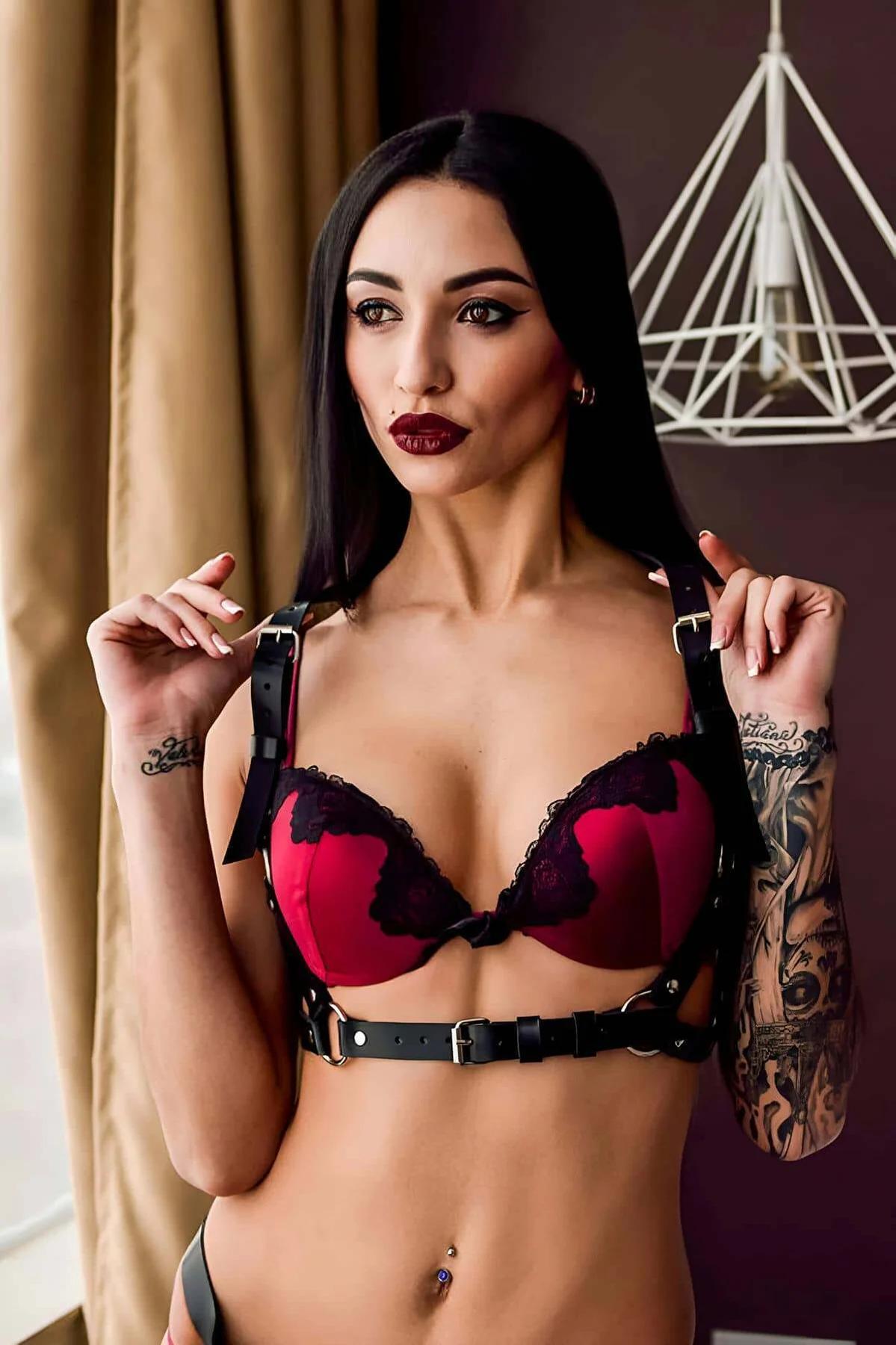 black PU leather chest and waist harness with silver O-ring seen from upper back