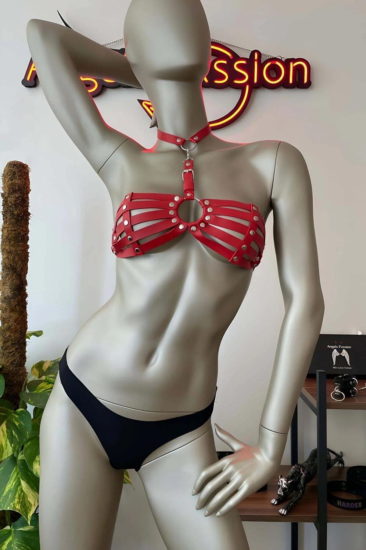 Front view of red multi-band chest harness bra showing O-ring halter connector detail