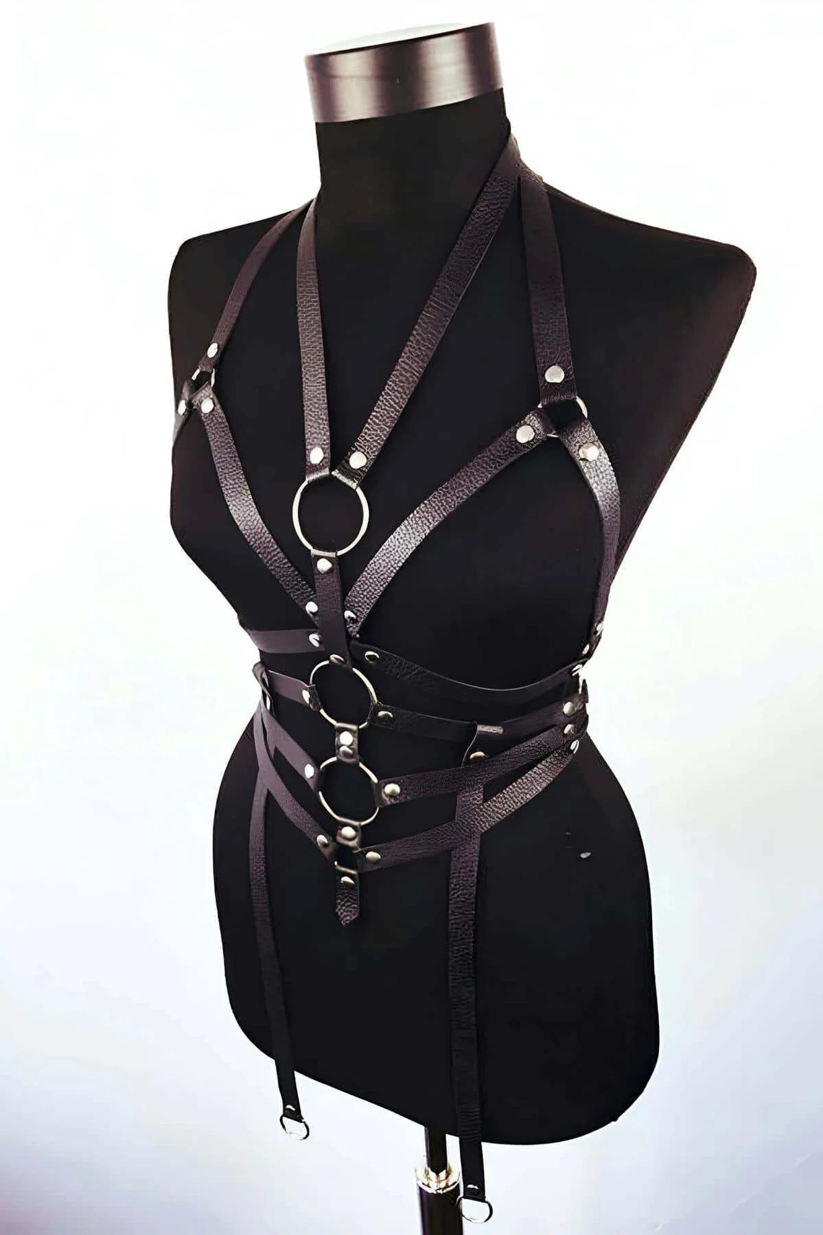 Flat black faux leather straps with double-cap silver rivets detail on body harness