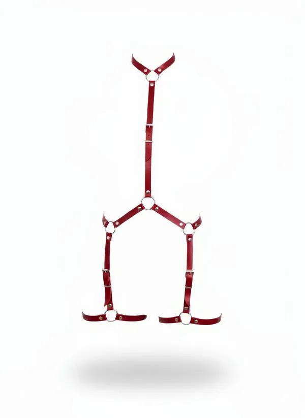 Red faux leather adjustable body harness with silver O-rings and dual thigh leg loops, full-length front view