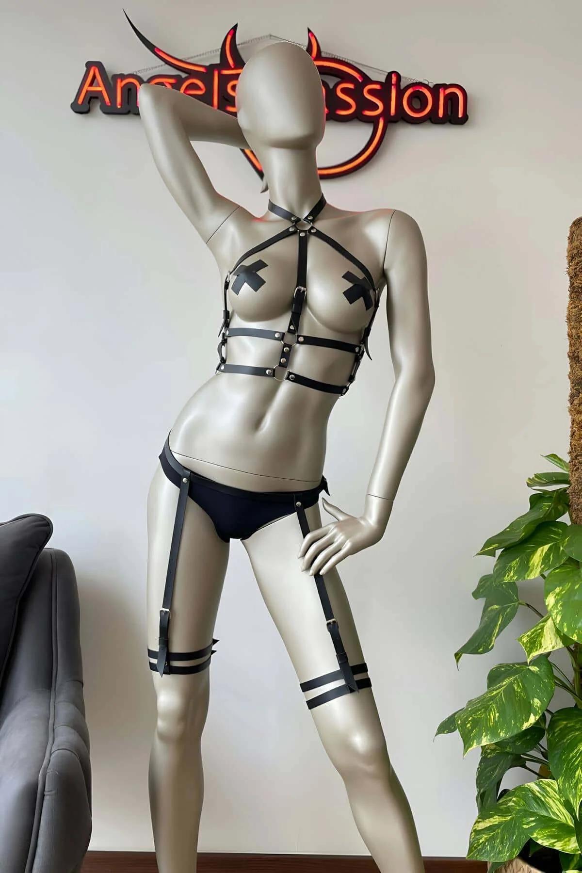 Black faux leather body harness waist and hip strap configuration with silver buckles