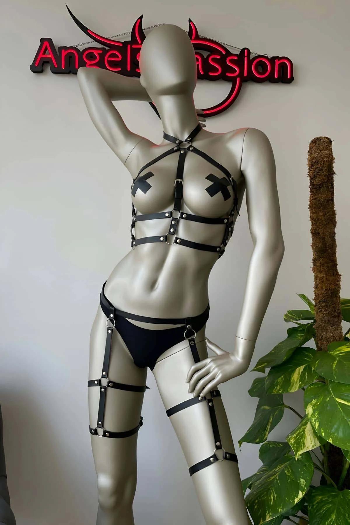 Black faux leather thigh garter bands with outer-leg O-ring and pin-buckle closures on both legs
