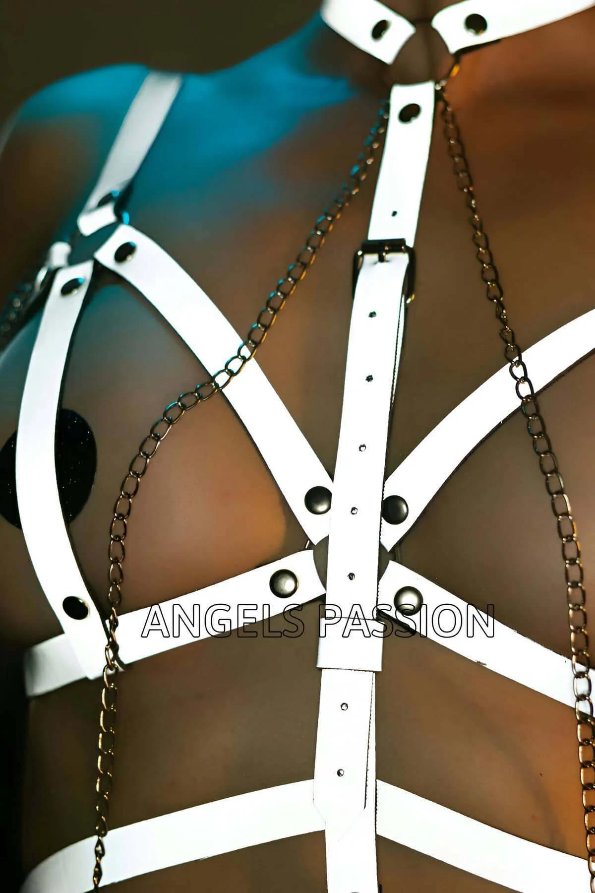 Full-length side view of reflective white strap body harness with layered chain accents