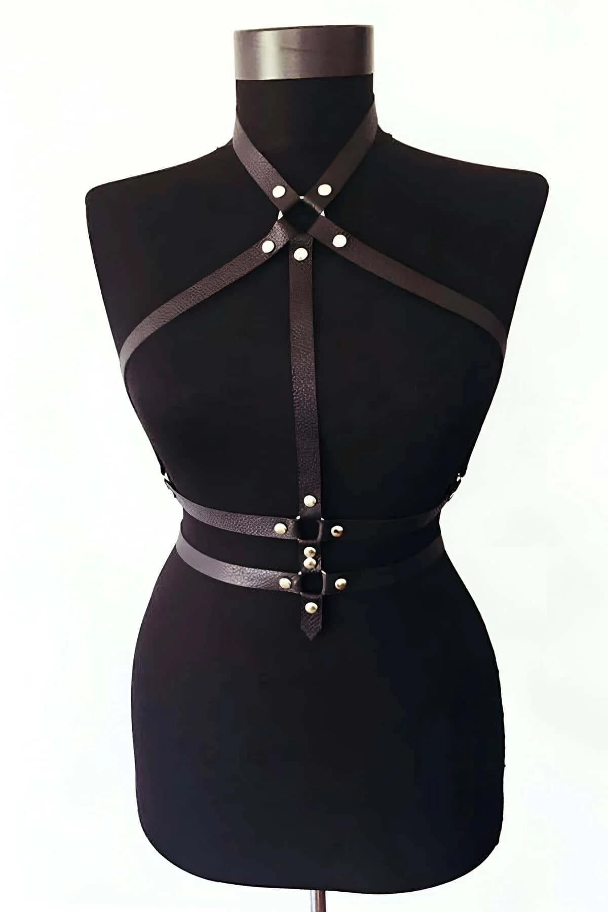 side view of black strappy body harness showing waist anchor band and adjustable buckle