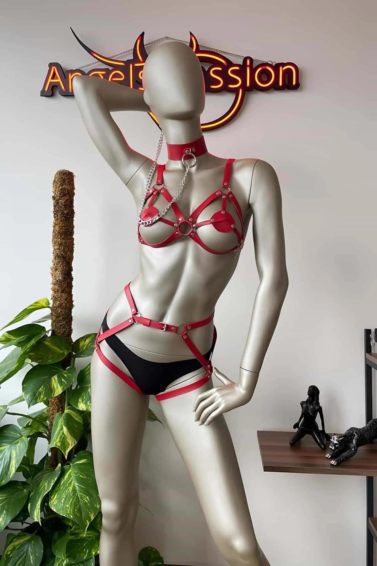 Red PU leather chest harness with silver O-rings and roller buckles close-up detail