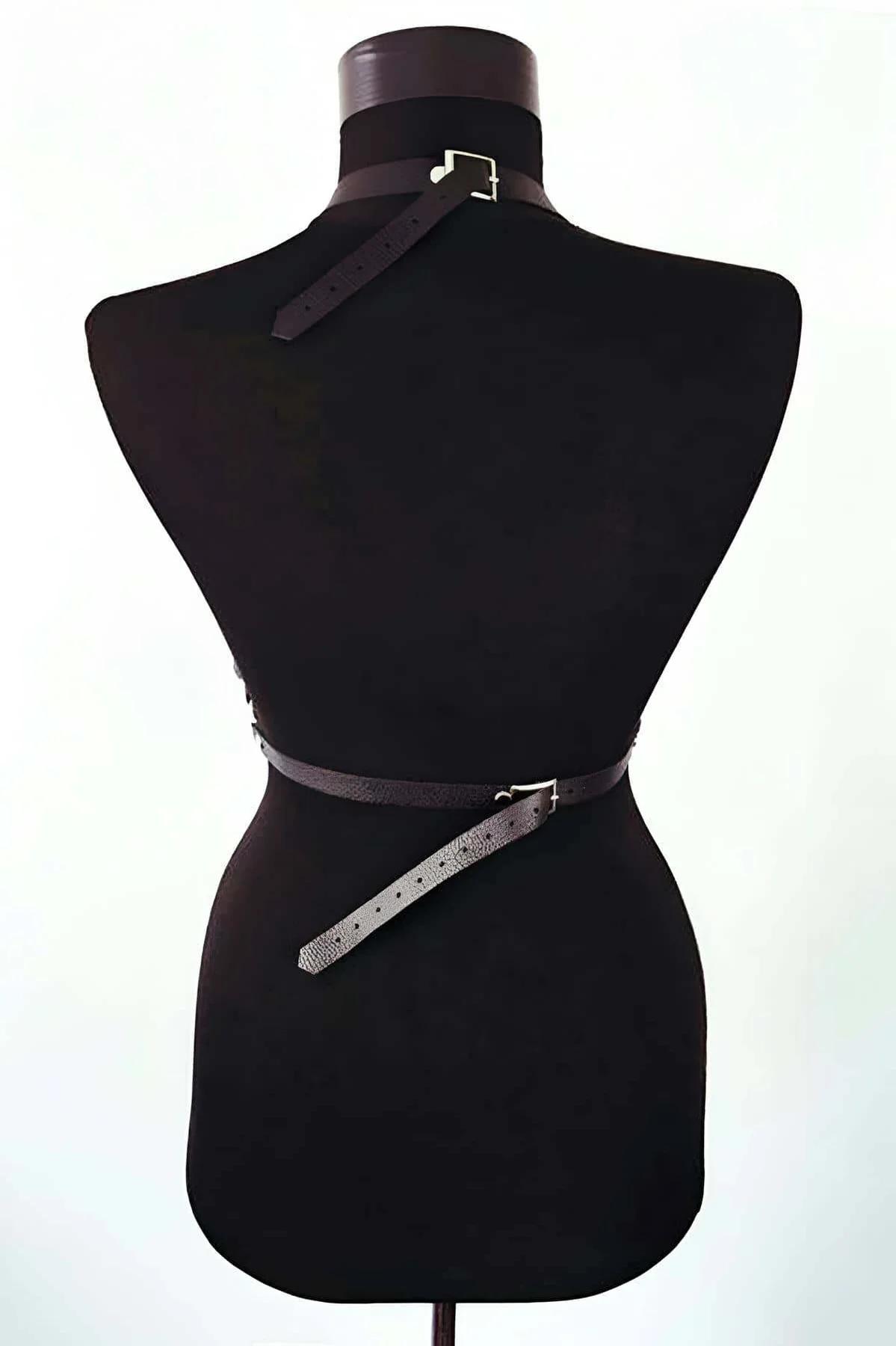 Adjustable silver buckle on shoulder strap of black PU leather body harness