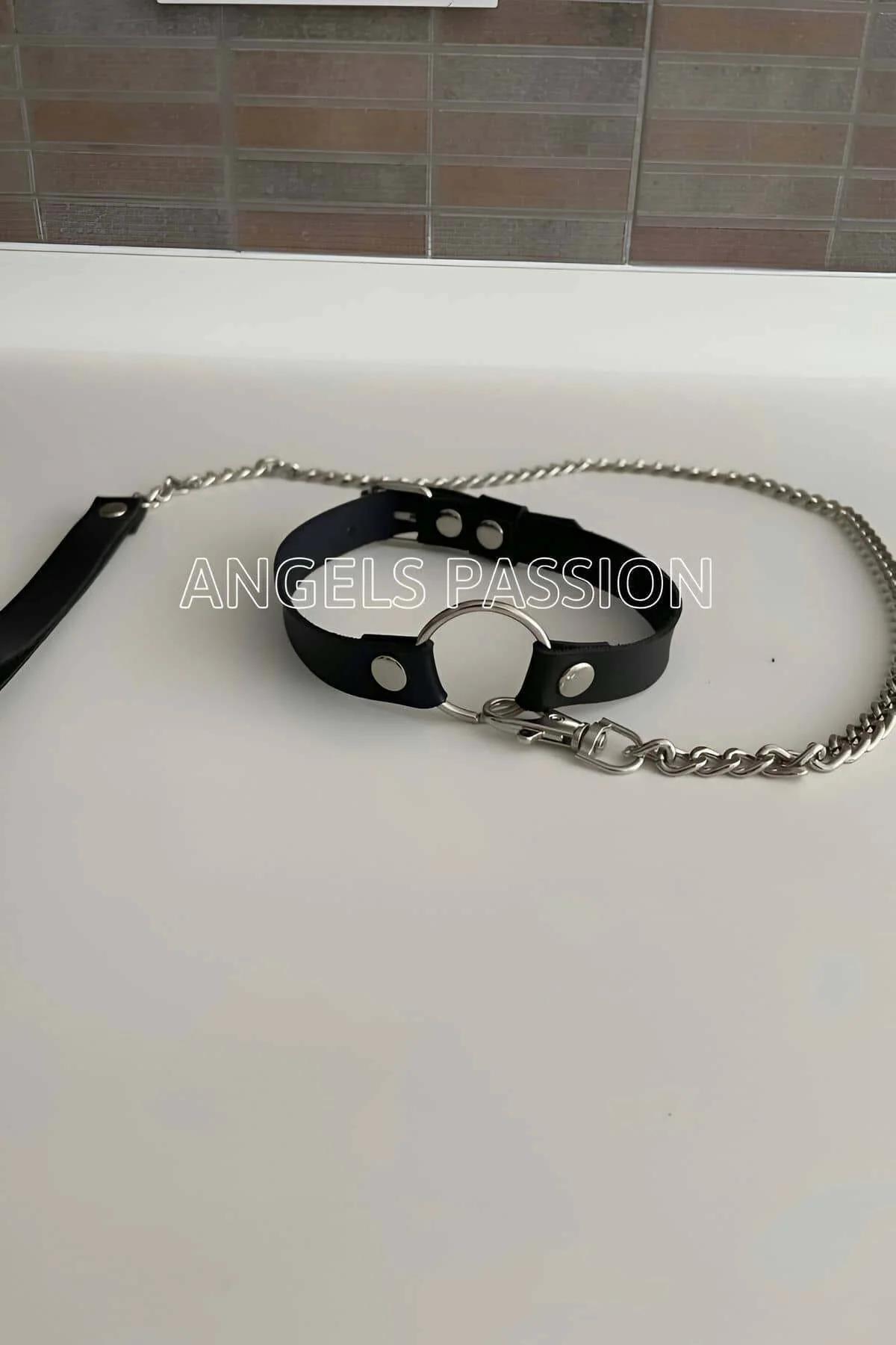 Black choker collar worn as standalone accessory without chain on model