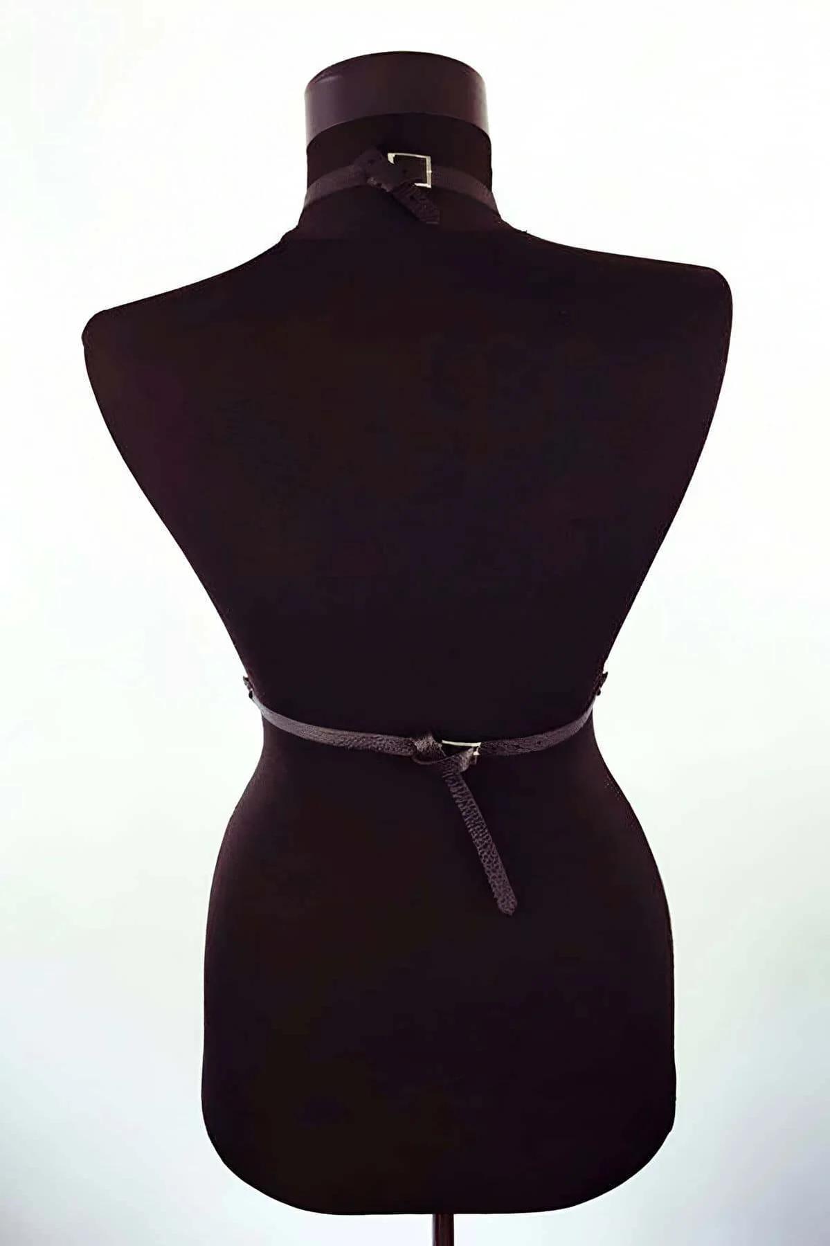 Black body harness garter straps with terminal O-ring loops hanging from waist band