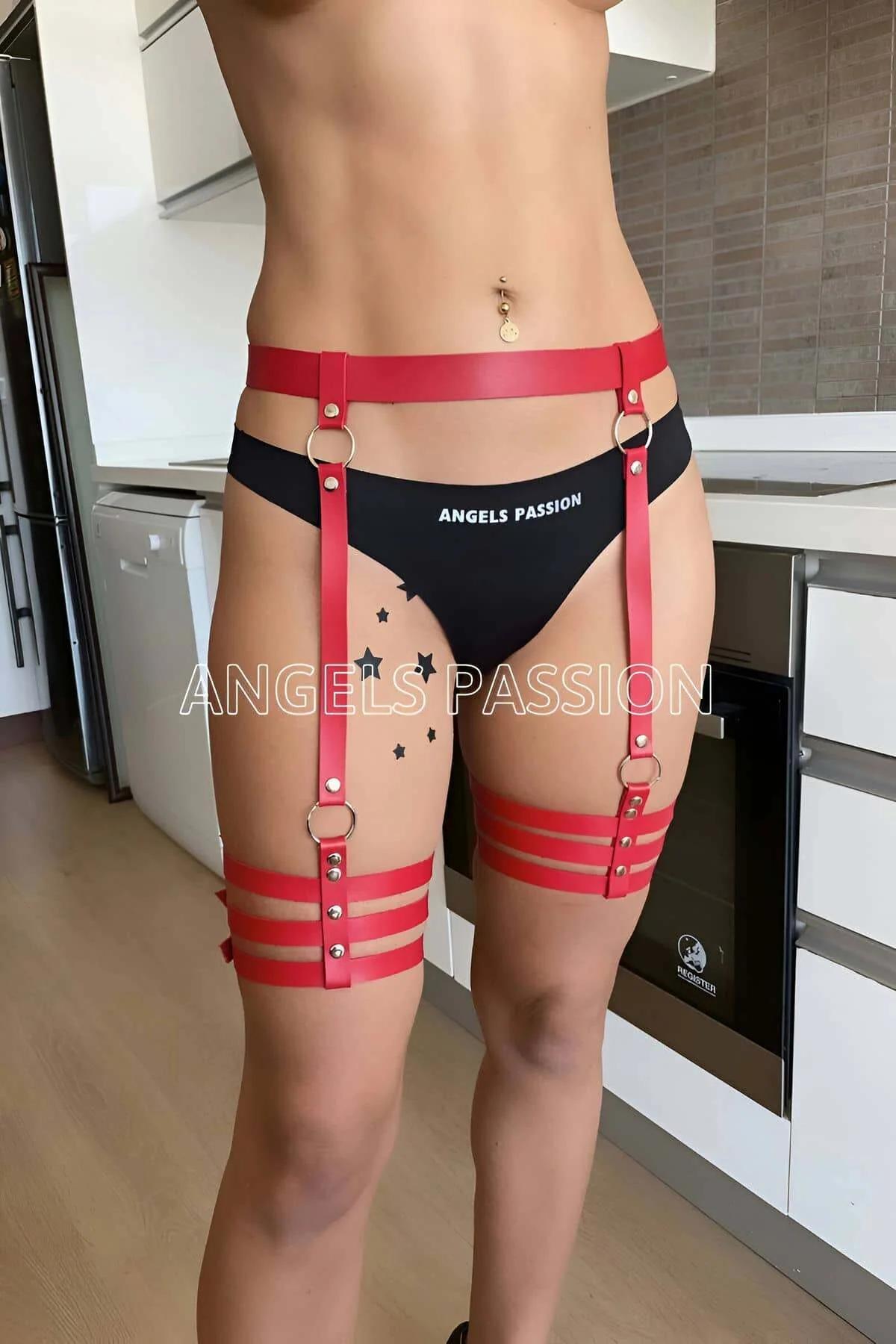 Close-up of red vegan leather thigh straps and zinc alloy buckle closures on garter harness