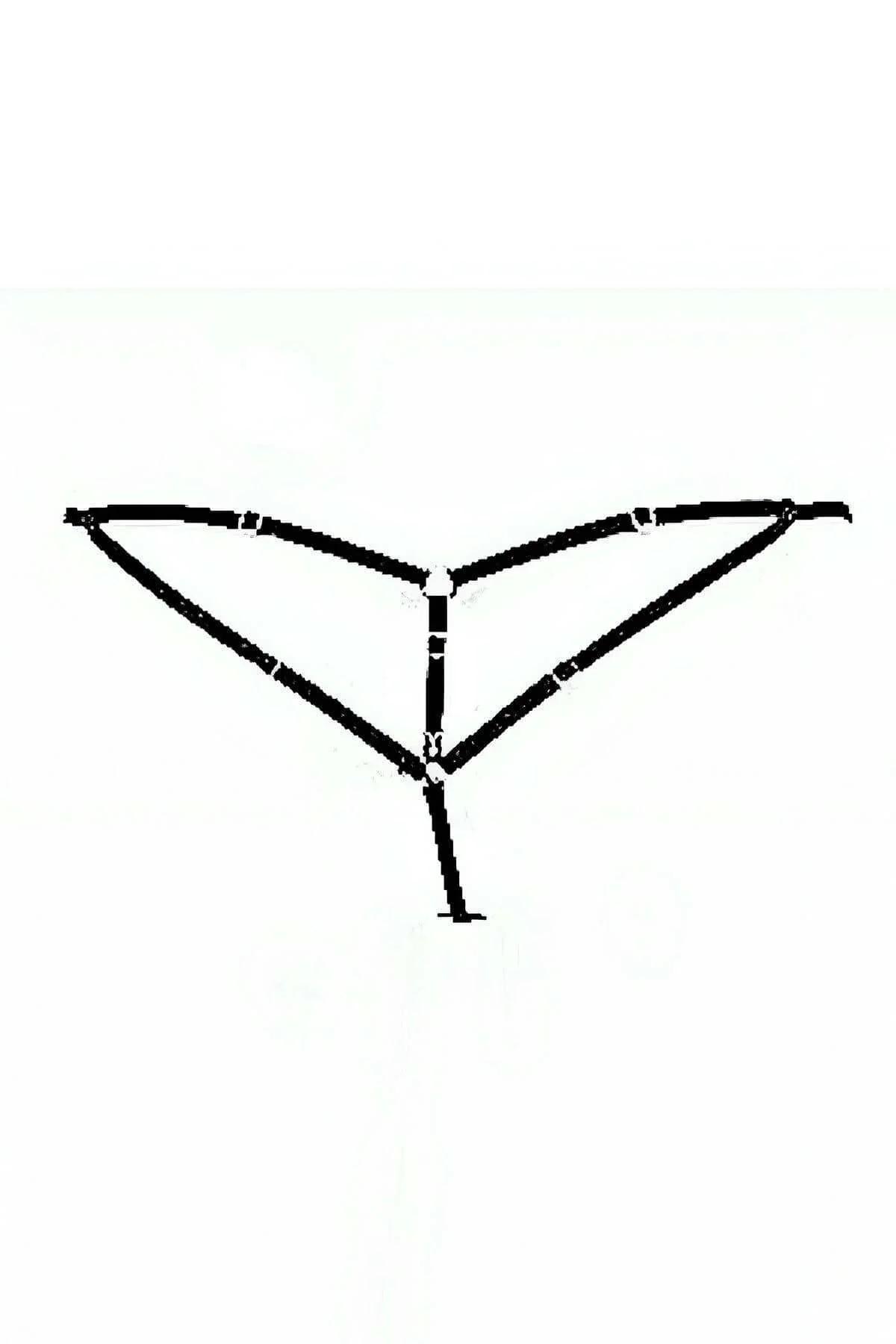 close-up of four silver O-rings connecting black elastic strap junctions on harness thong