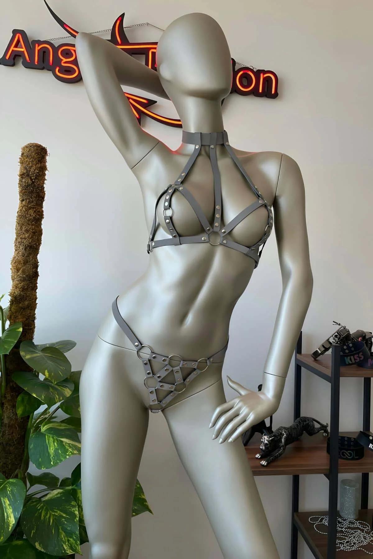 White reflective two-piece harness set worn over dark background, full body silhouette view
