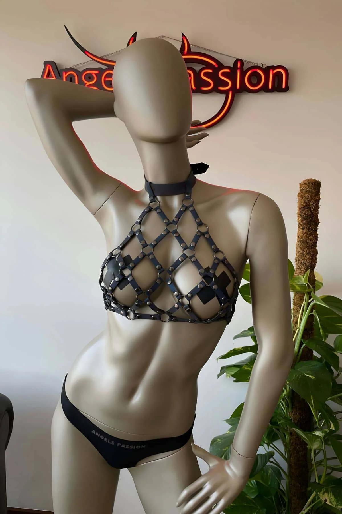 Full chest coverage view of iridescent holographic harness top with adjustable back closure in festival setting