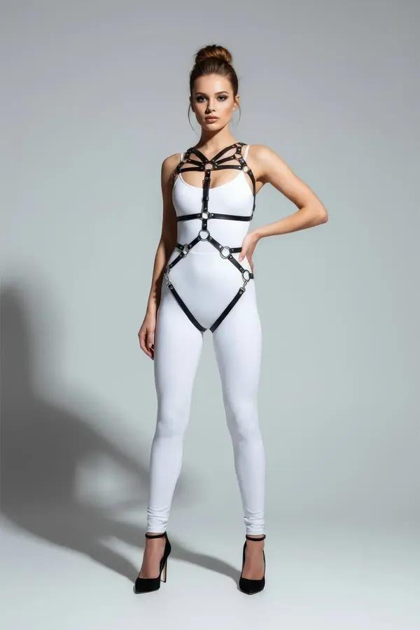 Black faux leather full body harness with four silver O-rings, cage chest straps and diamond hip frame, worn over white bodys